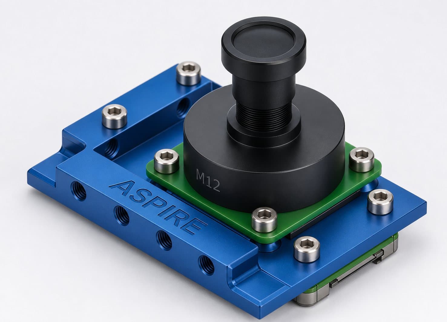 Digital twin render of the ASPIRE camera: an M12 lens on a green sensor board, mounted to a blue machined bracket engraved ASPIRE.
